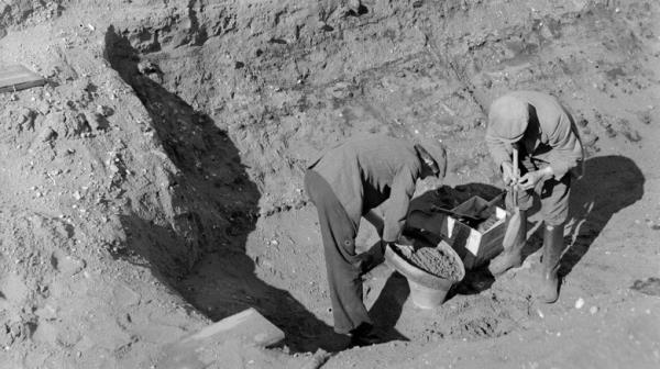 Four figures excavating Sutton Hoo burial, 1939
